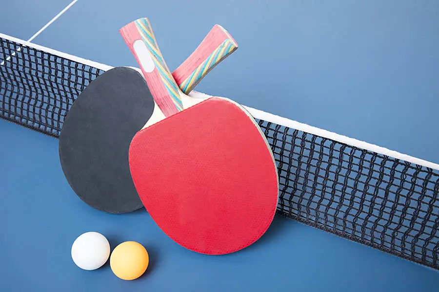 Red and black sides of a ping pong paddle